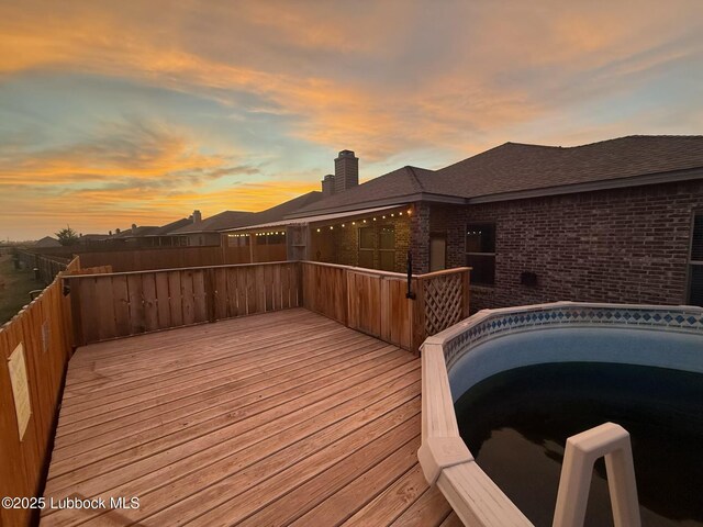 7501 100th St, Lubbock, TX 79424 - view of deck at dusk