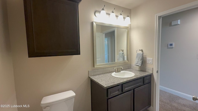 7501 100th St, Lubbock, TX 79424 - bathroom featuring vanity and toilet