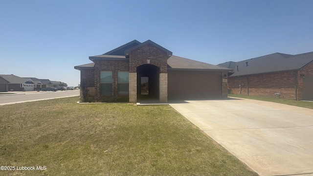 7501 100th St, Lubbock, TX 79424 - view of front of house featuring brick siding, driveway, a garage, and a front lawn