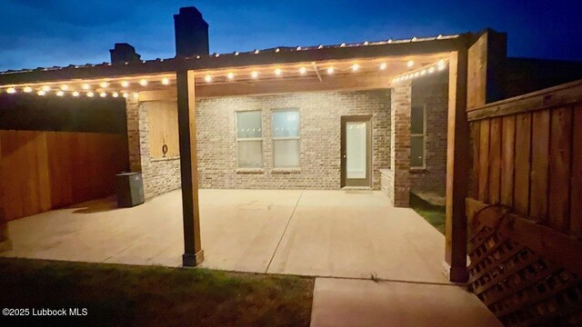7501 100th St, Lubbock, TX 79424 - patio at night with a patio area