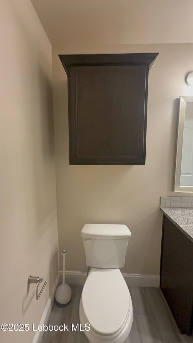 7501 100th St, Lubbock, TX 79424 - bathroom with toilet and vanity