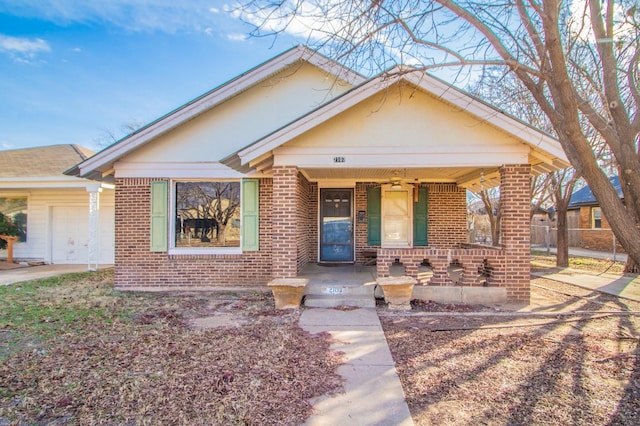 bungalow featuring a garage and covered porch