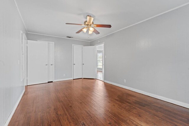 empty room featuring crown molding, ceiling fan, and hardwood / wood-style flooring