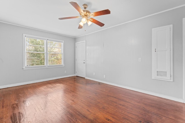 spare room featuring crown molding, hardwood / wood-style floors, and ceiling fan