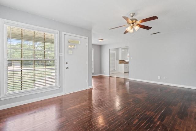 unfurnished living room featuring hardwood / wood-style floors and ceiling fan