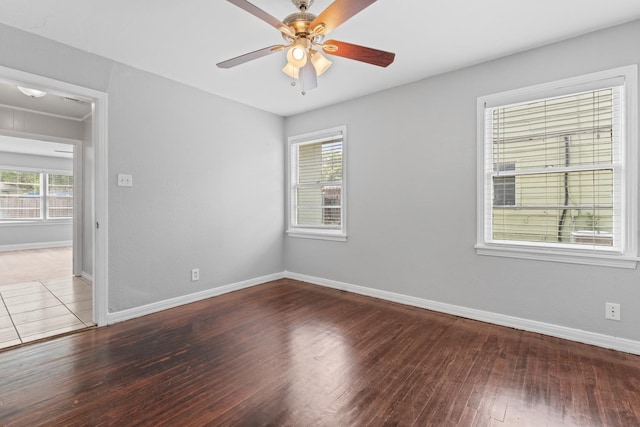 unfurnished room with ceiling fan, a healthy amount of sunlight, and hardwood / wood-style floors