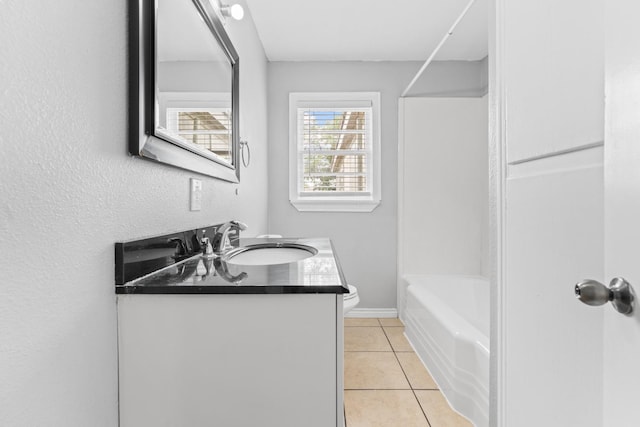 full bathroom featuring tile patterned flooring, vanity, tub / shower combination, and toilet