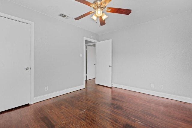 unfurnished bedroom with dark hardwood / wood-style floors and ceiling fan