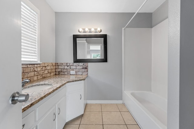 bathroom with vanity, shower / bathing tub combination, tile patterned flooring, and decorative backsplash