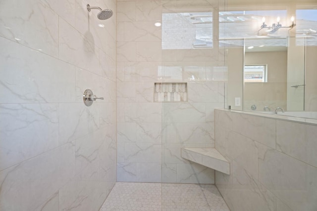 bathroom with a tile shower