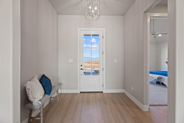 entryway with a chandelier and light hardwood / wood-style floors