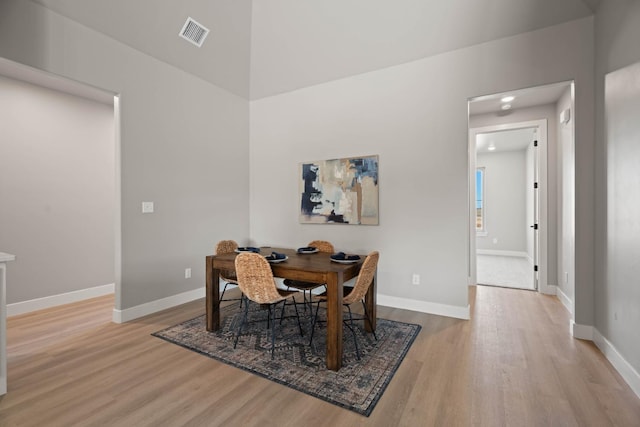 dining area with light hardwood / wood-style floors