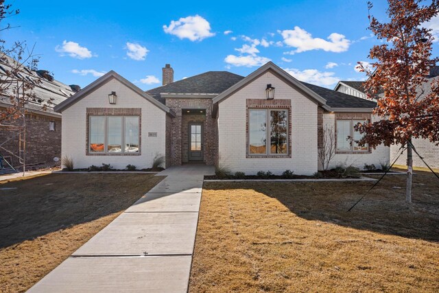 view of front of home with a front yard