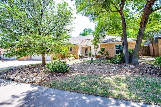 5411 89th St, Lubbock, TX 79424 - ranch-style home featuring a garage, fence, brick siding, and driveway