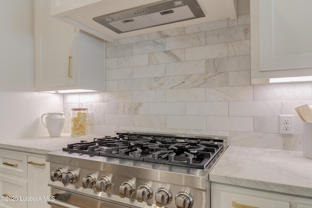 10506 Troy Ave, Lubbock, TX 79424 - kitchen with range hood, white cabinets, and light stone counters