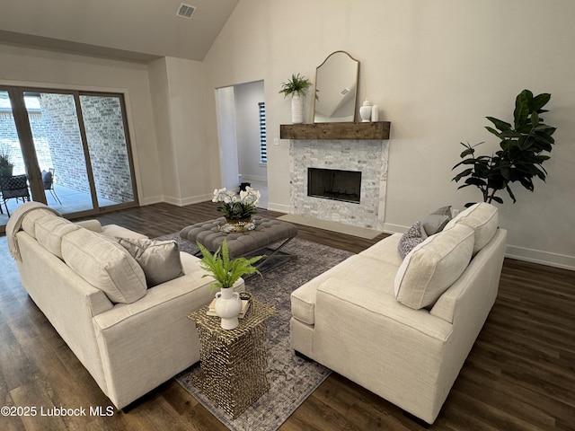 10506 Troy Ave, Lubbock, TX 79424 - living room featuring wood finished floors, baseboards, a fireplace, and high vaulted ceiling