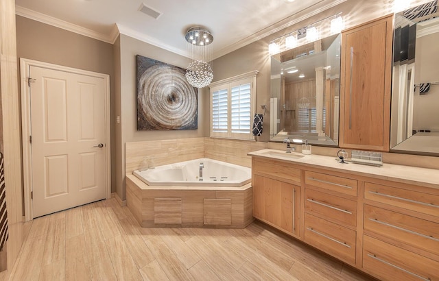 9807 Topeka Ave, Lubbock, TX 79424 - full bathroom with a bath, visible vents, wood finished floors, vanity, and ornamental molding