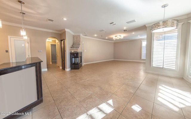 9807 Topeka Ave, Lubbock, TX 79424 - unfurnished living room with crown molding, stairs, light tile patterned flooring, baseboards, and arched walkways