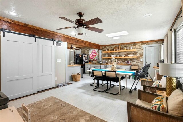 unfurnished room featuring dark hardwood / wood-style flooring, ceiling fan, ornamental molding, and a textured ceiling