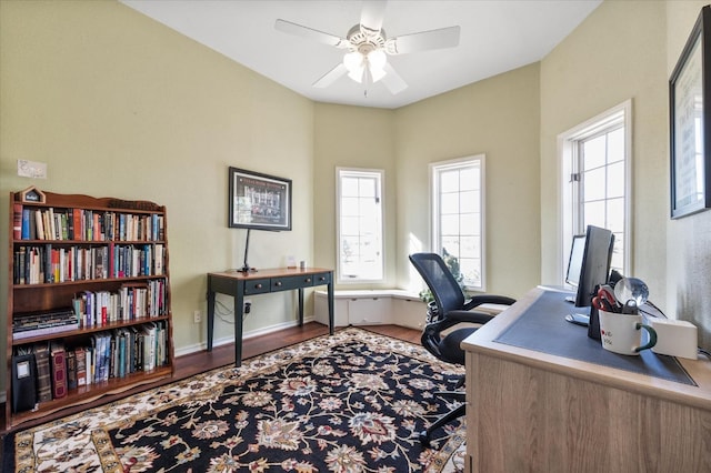 home office featuring hardwood / wood-style flooring and ceiling fan