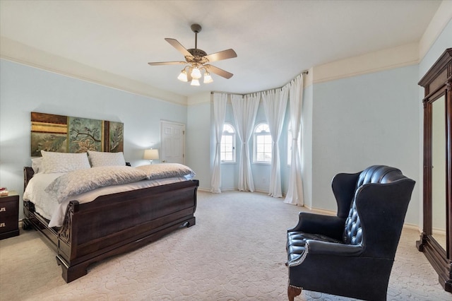 bedroom with light carpet and ceiling fan