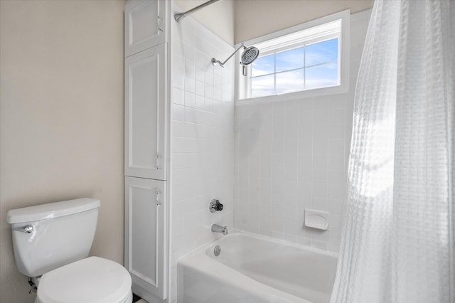 bathroom with shower / tub combo and toilet