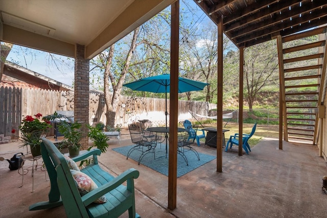 view of patio with an outdoor fire pit