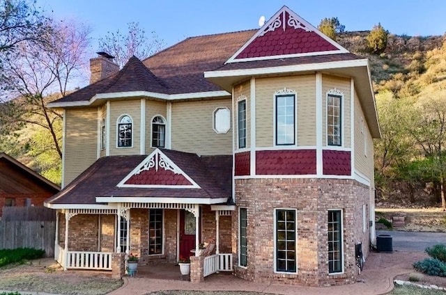 view of front of home with central AC and covered porch