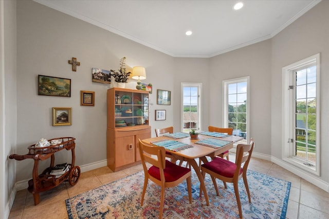 dining room featuring ornamental molding and light tile patterned floors