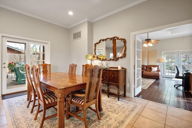 dining room featuring light tile patterned floors, ornamental molding, french doors, and ceiling fan