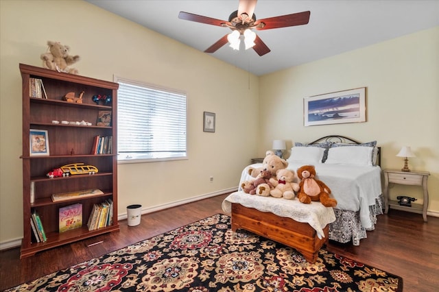 bedroom with ceiling fan and dark hardwood / wood-style flooring