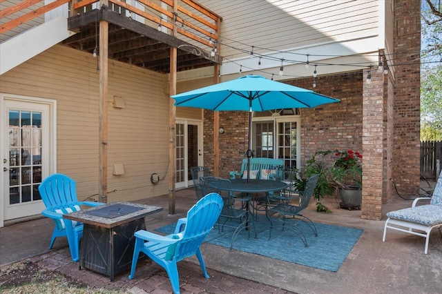 view of patio / terrace with an outdoor fire pit