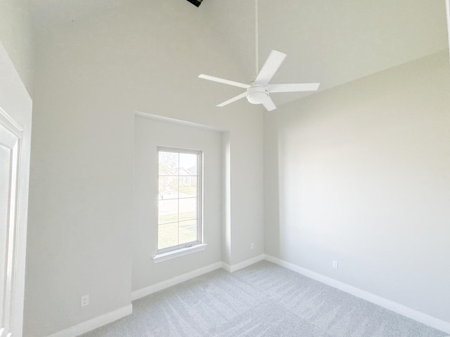 unfurnished room featuring light carpet and ceiling fan