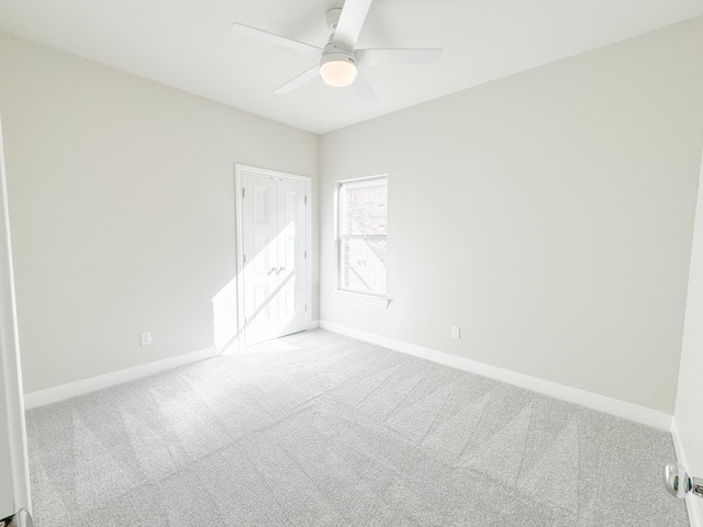 unfurnished room featuring carpet floors and ceiling fan