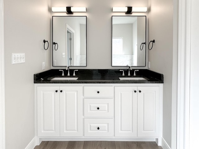 bathroom featuring vanity and wood-type flooring