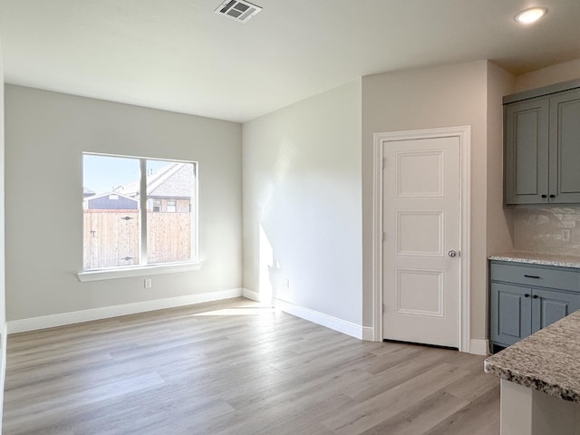 unfurnished dining area with light hardwood / wood-style flooring