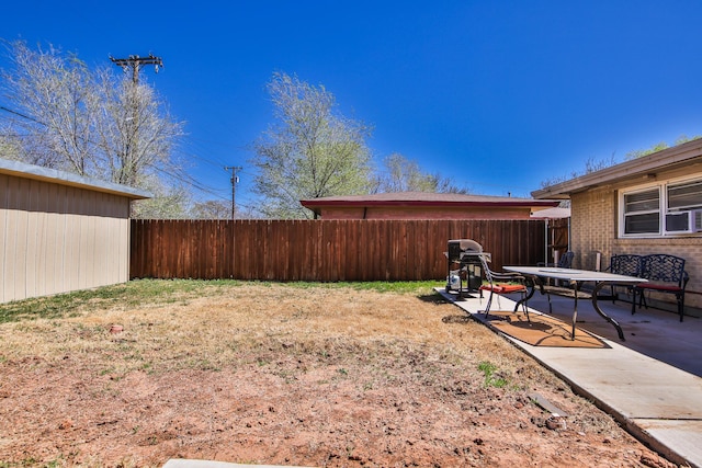 view of yard with a patio and a fenced backyard
