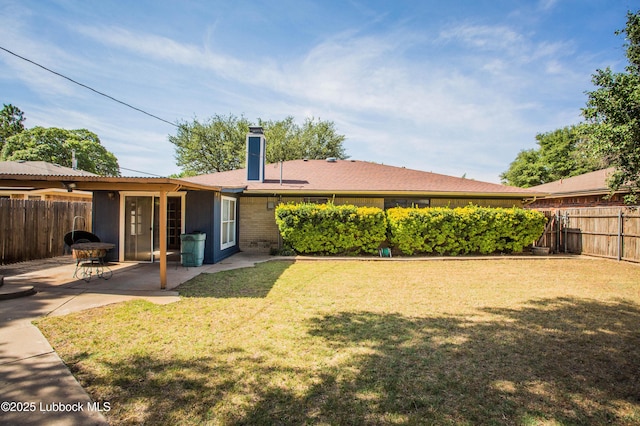 5008 59th St, Lubbock, TX 79414 - fenced backyard featuring a patio