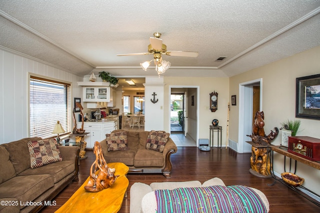 5008 59th St, Lubbock, TX 79414 - living room featuring a textured ceiling, hardwood / wood-style flooring, plenty of natural light, crown molding, and a ceiling fan
