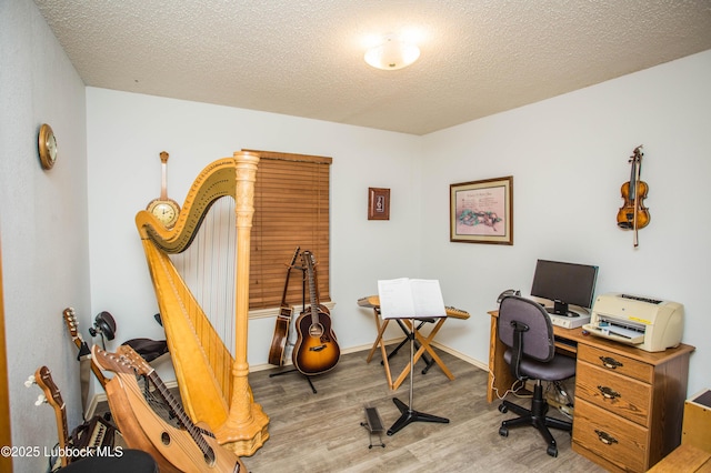 5008 59th St, Lubbock, TX 79414 - office area with wood finished floors and a textured ceiling