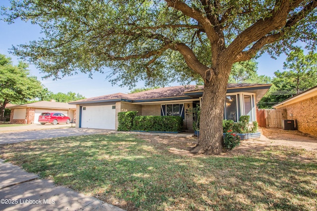 5008 59th St, Lubbock, TX 79414 - single story home with concrete driveway, a garage, and brick siding