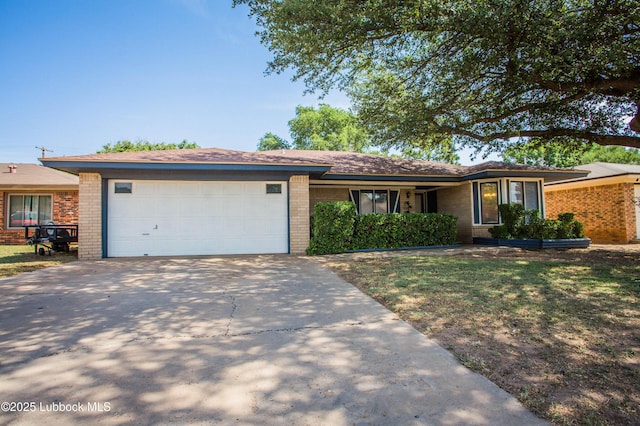 5008 59th St, Lubbock, TX 79414 - ranch-style house with brick siding, an attached garage, and concrete driveway