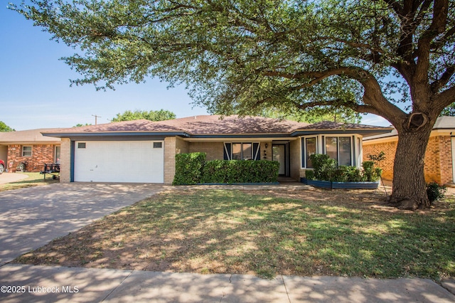 5008 59th St, Lubbock, TX 79414 - single story home featuring brick siding, an attached garage, driveway, and a front yard