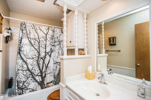 5008 59th St, Lubbock, TX 79414 - bathroom with vanity, a textured ceiling, and shower / tub combo with curtain