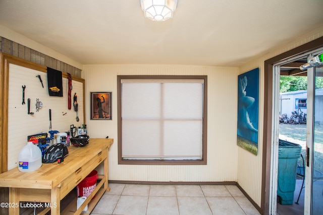 5008 59th St, Lubbock, TX 79414 - doorway to outside with light tile patterned flooring and baseboards
