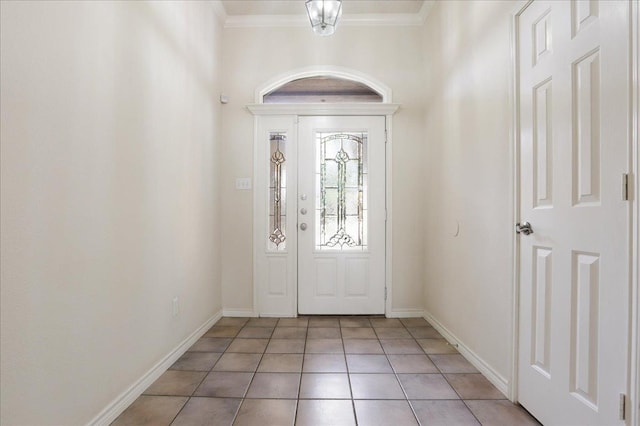 entryway featuring crown molding and light tile patterned floors