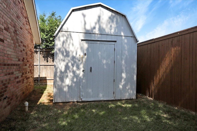 view of outbuilding featuring a lawn