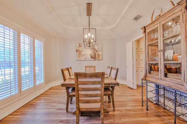 5419 87th St, Lubbock, TX 79424 - dining room with a chandelier, plenty of natural light, and light wood-style flooring