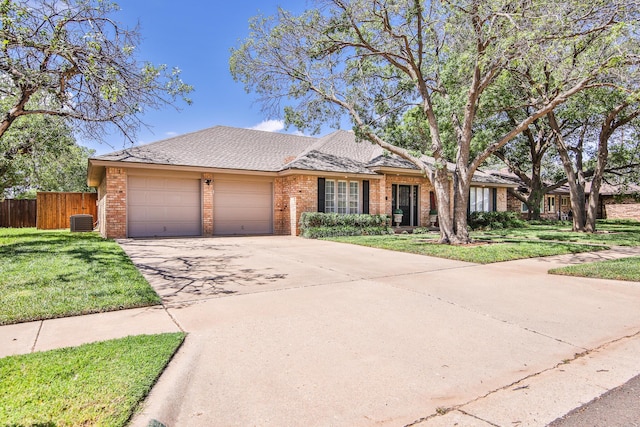 5419 87th St, Lubbock, TX 79424 - view of front of property with brick siding, an attached garage, and concrete driveway