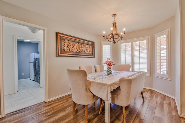 5419 87th St, Lubbock, TX 79424 - dining space featuring a chandelier, light wood finished floors, and healthy amount of natural light